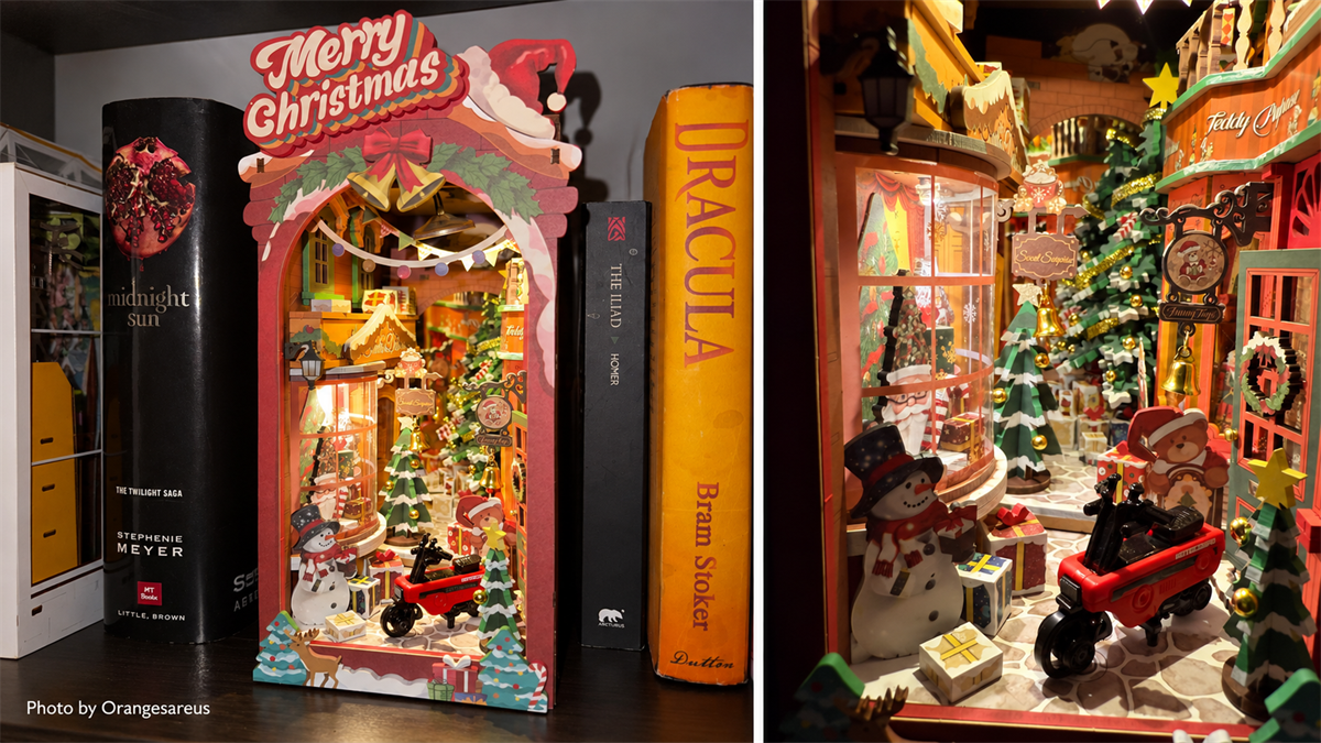 Orangesareus’ hand-painted Rolife Christmas Street book nook with an illuminated interior detail