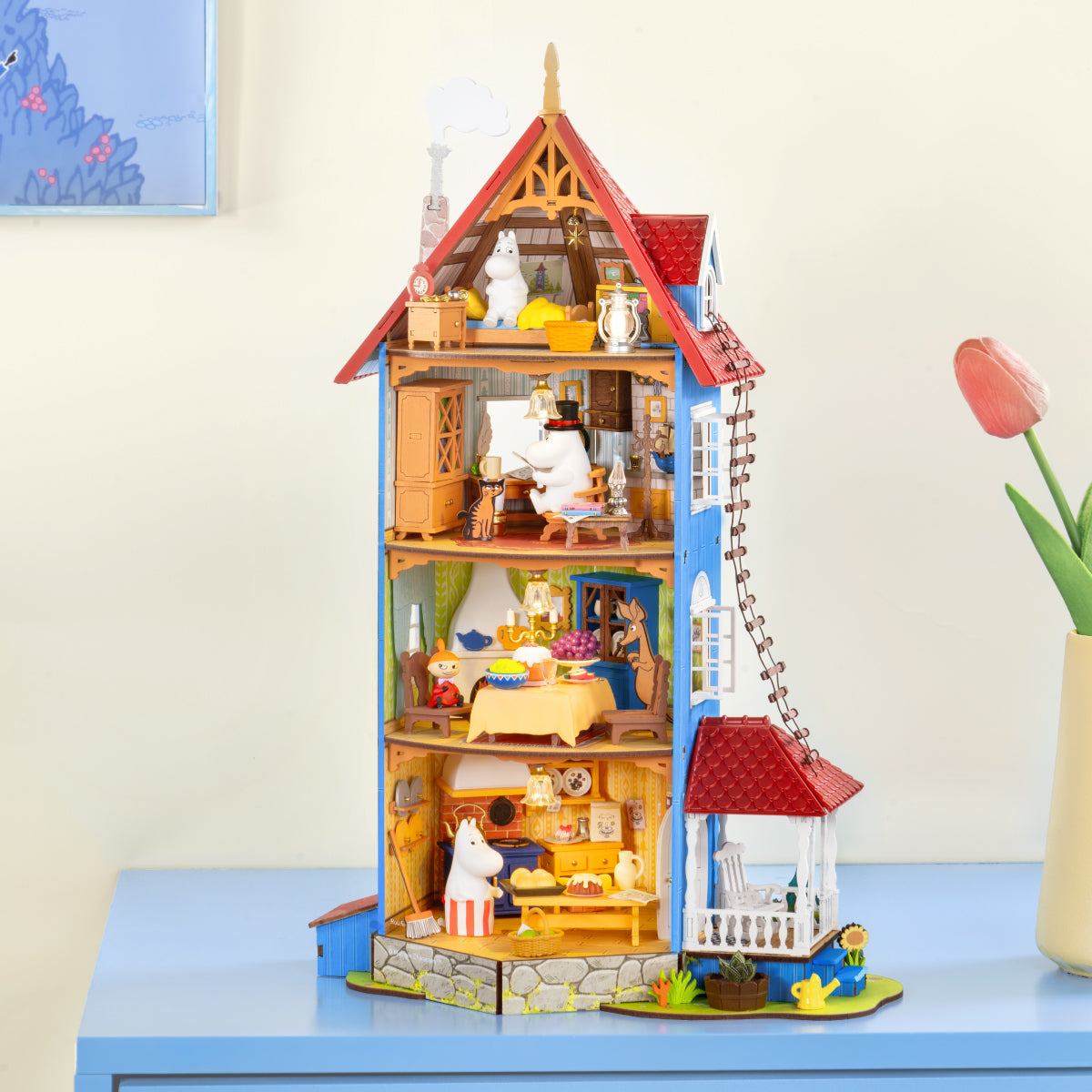 Rolife Moominhouse DIY miniature house displayed on a tabletop with interior rooms