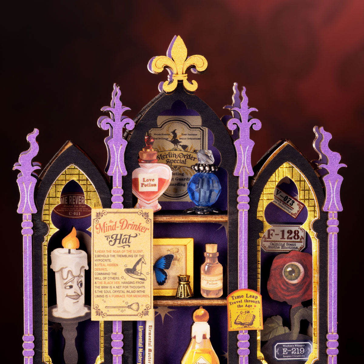 Rolife Curio Corner DS056 close-up showing crystal ball, wizard hat, potion bottles, Atlas book, scrolls, gears and ornate clock counter