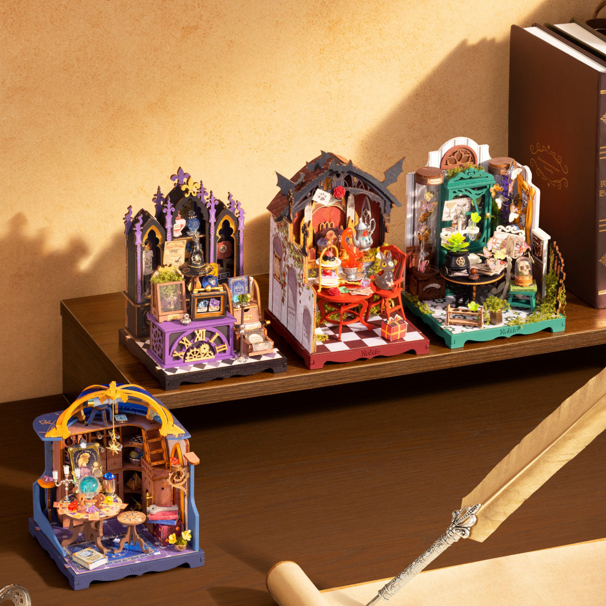 Rolife Magic House series miniatures arranged on a bookshelf with warm sunlight, books, scroll and decorative writing quill