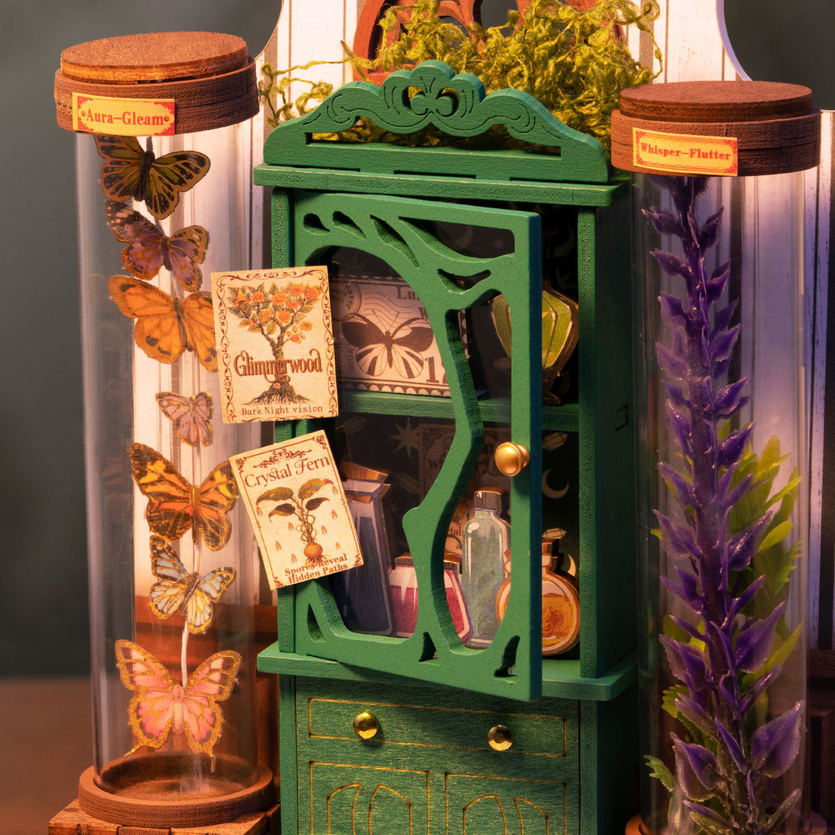 Rolife Potions Workshop DS057 close-up of green cabinet with butterfly specimens, Aura-Gleam and Whisper-Flutter jars, potion bottles and botanical labels