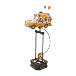 ROKR Road Tripper Gravity Swing MCD03 clean white-background hero shot of orange wooden SUV with gear counterweight balanced on black pendulum stand