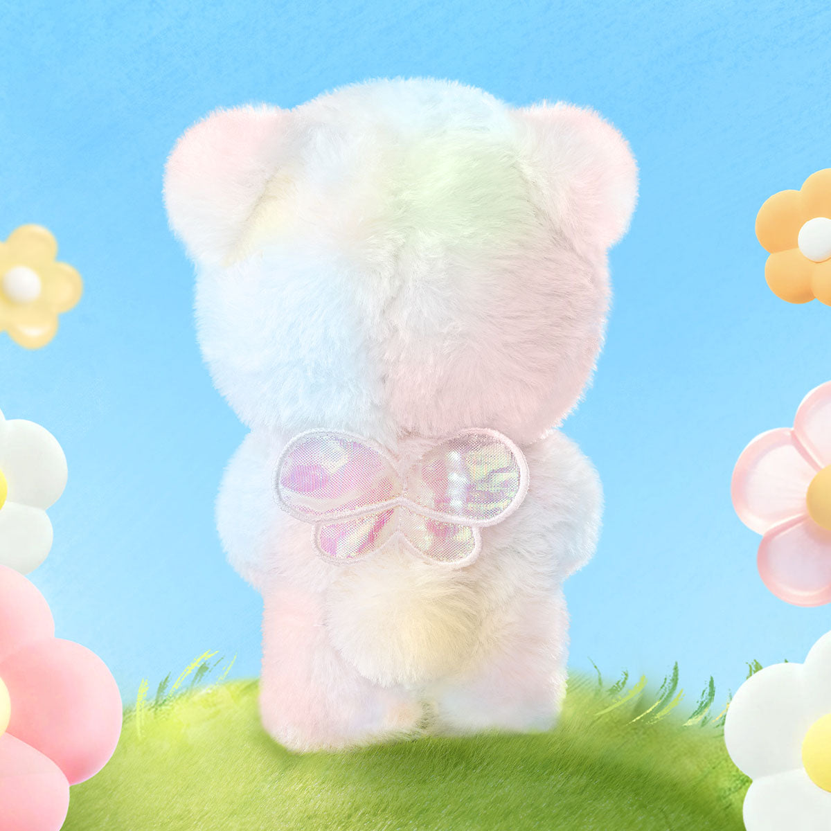 Back view of the Nanci Spring Bear plush pendant showing the bow and soft plush texture