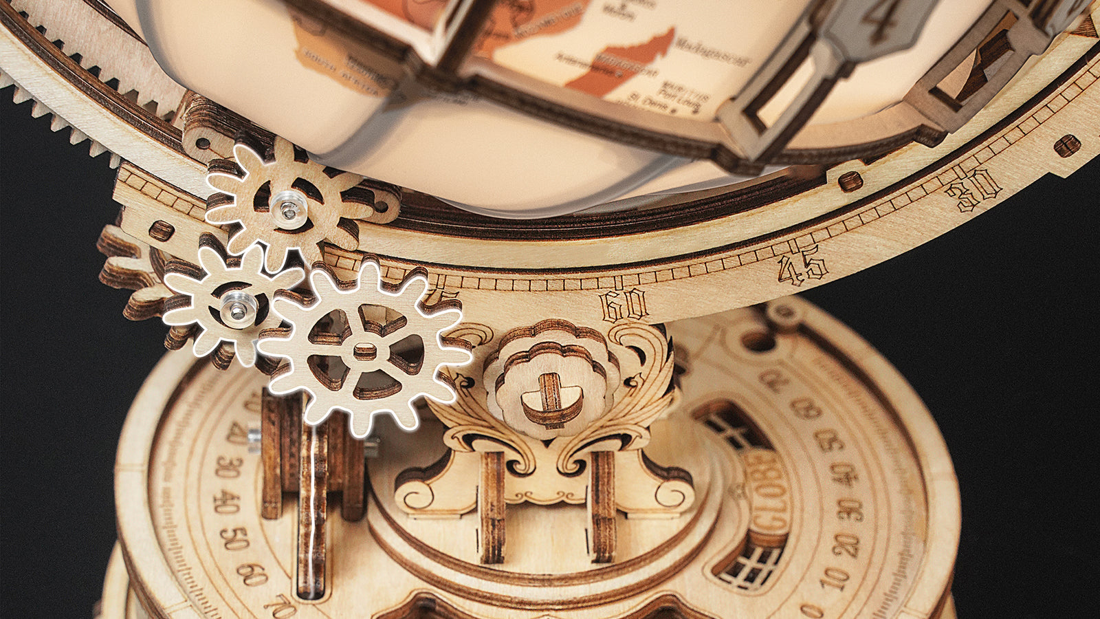 Gear-driven globe and magnifier